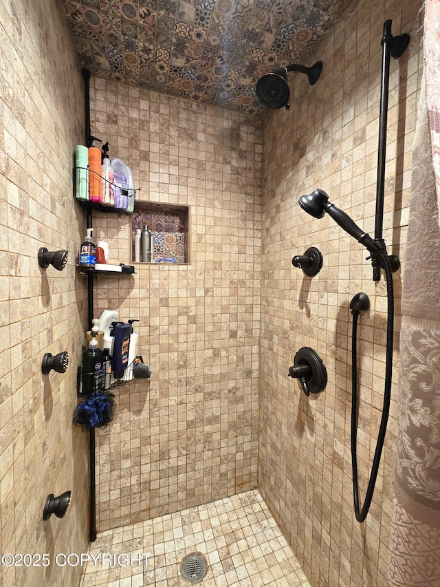 bathroom with a tile shower