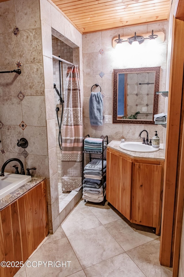 full bath featuring vanity, tile walls, wood ceiling, and tiled shower