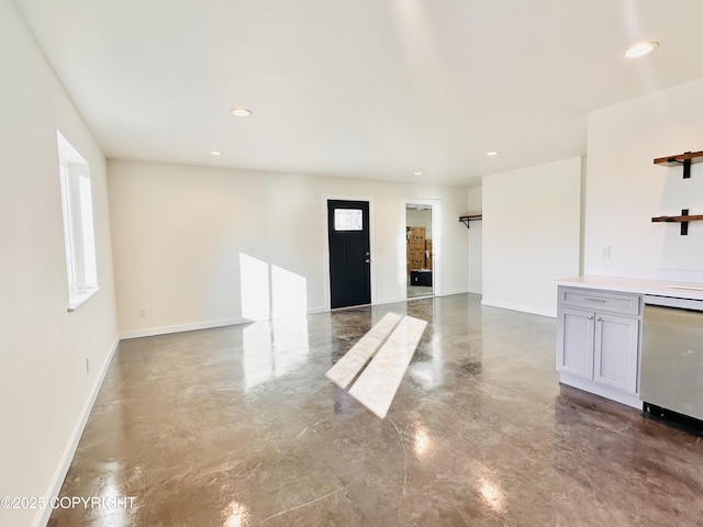 interior space featuring recessed lighting and baseboards