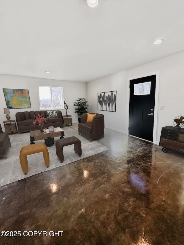 living room with baseboards, concrete floors, and recessed lighting