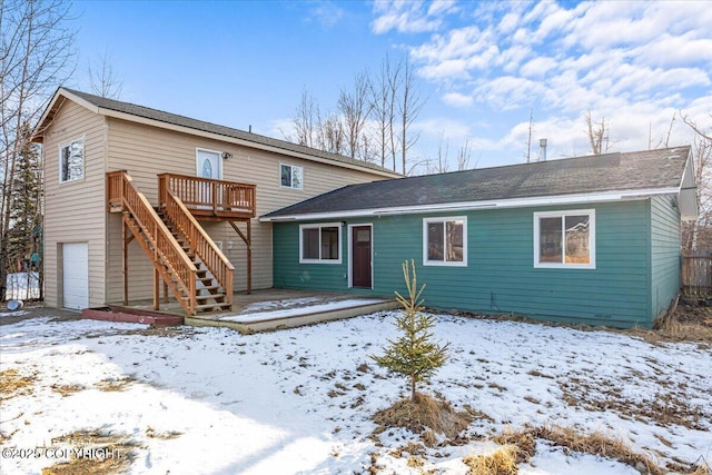 view of front of property featuring stairway and a wooden deck