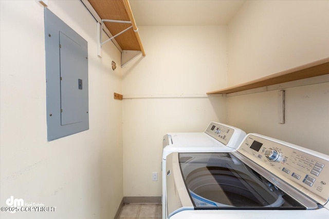 clothes washing area featuring laundry area, independent washer and dryer, electric panel, and baseboards