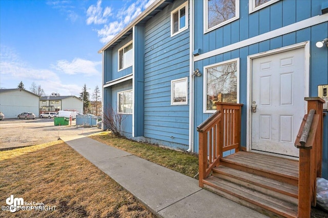 entrance to property featuring board and batten siding