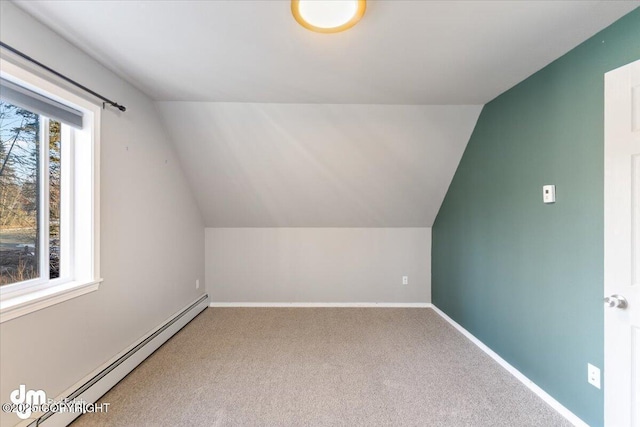 bonus room featuring baseboards, carpet floors, baseboard heating, and vaulted ceiling