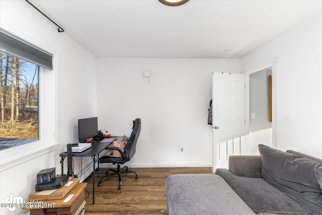 office area with wood finished floors and baseboards