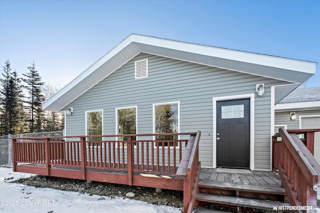 rear view of property with a deck