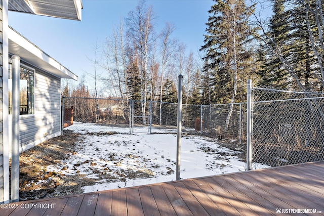 snow covered deck with fence