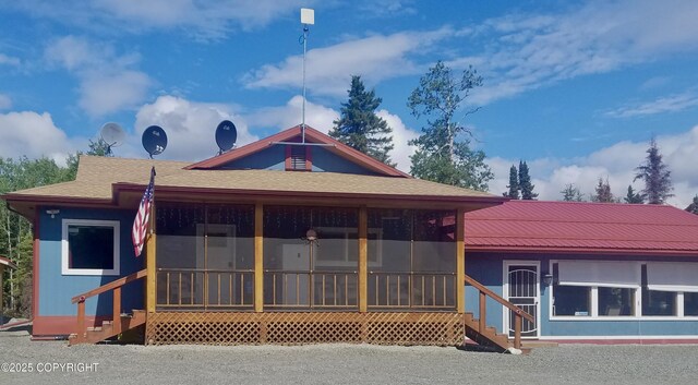35376 Betty Lou Dr, Sterling, AK 99672 - back of house featuring a shingled roof and a sunroom