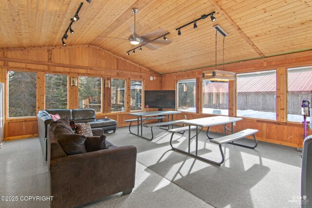 35376 Betty Lou Dr, Sterling, AK 99672 - sunroom featuring vaulted ceiling, wooden walls, and a wealth of natural light