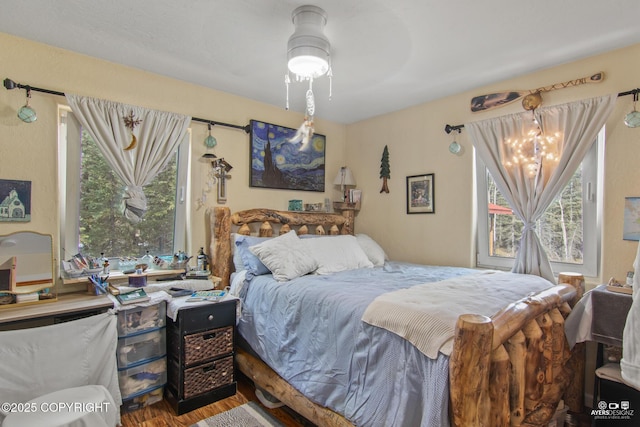 35376 Betty Lou Dr, Sterling, AK 99672 - bedroom with wood finished floors and a chandelier
