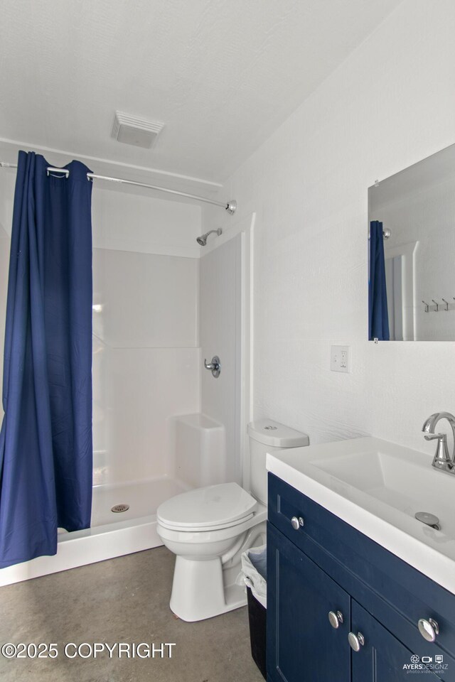 35376 Betty Lou Dr, Sterling, AK 99672 - full bathroom featuring vanity, visible vents, a stall shower, concrete flooring, and toilet