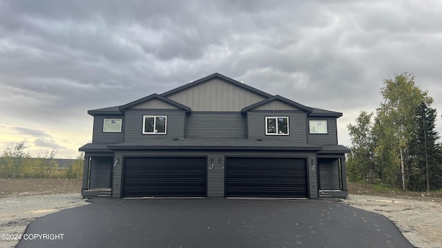 view of front facade featuring driveway and an attached garage