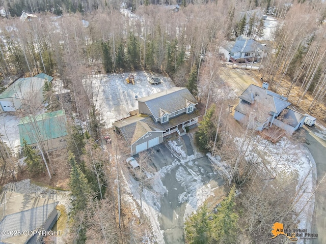 drone / aerial view featuring a view of trees