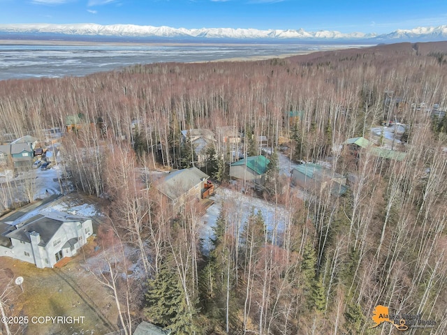 birds eye view of property featuring a view of trees