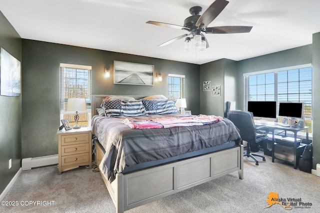 bedroom featuring multiple windows, carpet flooring, baseboards, and baseboard heating