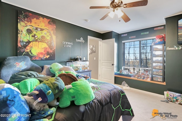 carpeted bedroom featuring ceiling fan and baseboards