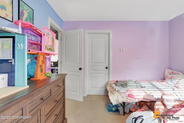 bedroom with light colored carpet