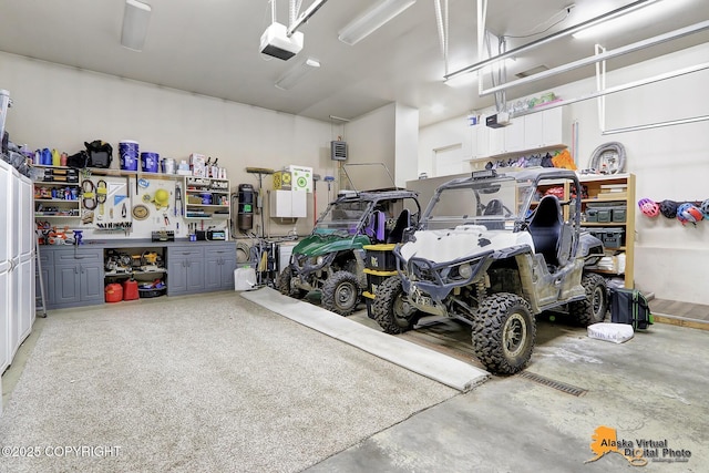 garage featuring a workshop area and a garage door opener