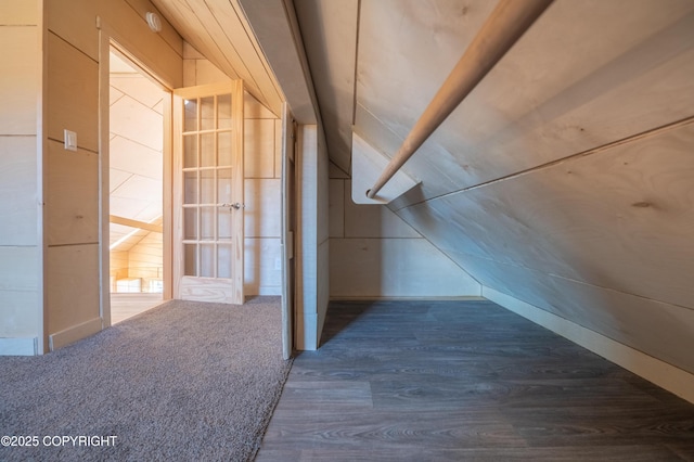 bonus room featuring lofted ceiling and wood finished floors