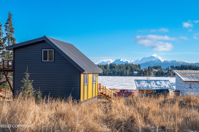 view of outbuilding featuring a mountain view