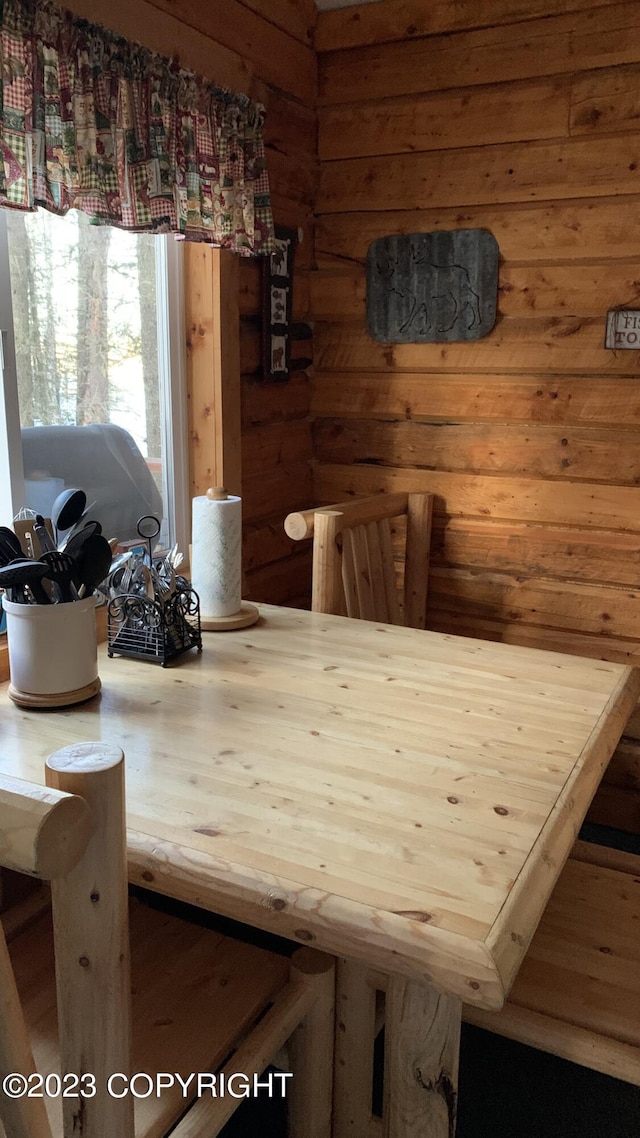 dining room with rustic walls