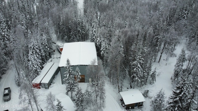 snowy aerial view with a forest view