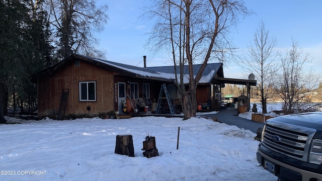 exterior space with a carport and covered porch