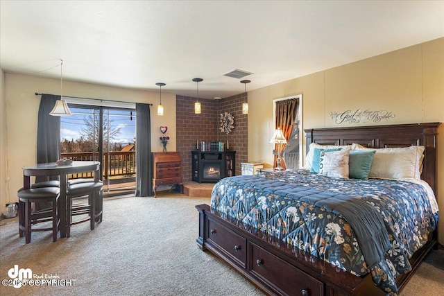 carpeted bedroom featuring visible vents and access to outside