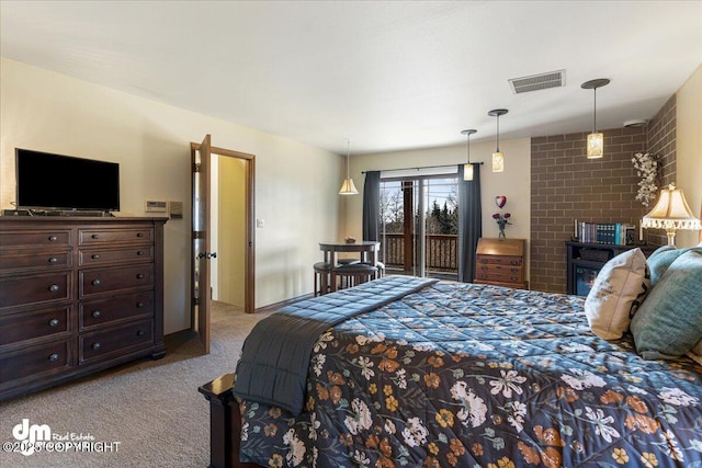 bedroom with visible vents, carpet floors, and access to outside