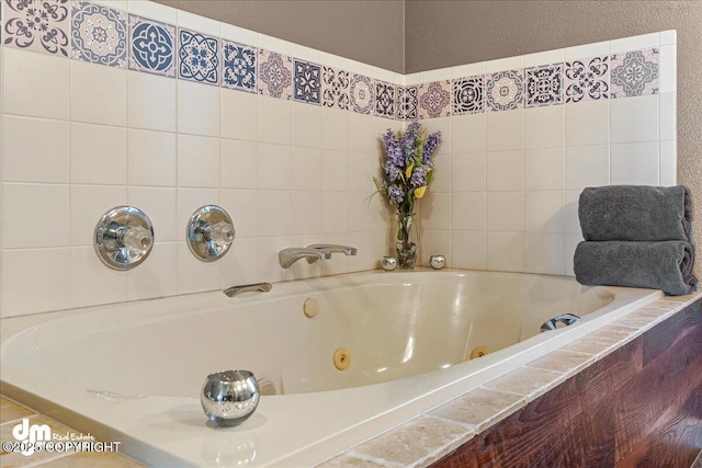 full bathroom featuring a whirlpool tub