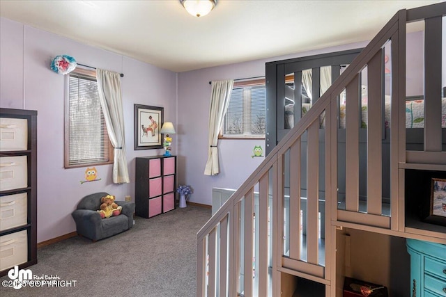 bedroom featuring carpet flooring and baseboards