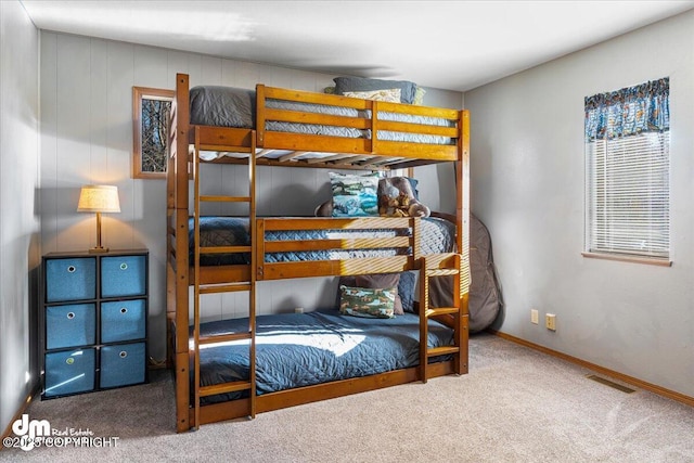 bedroom with carpet, visible vents, and baseboards