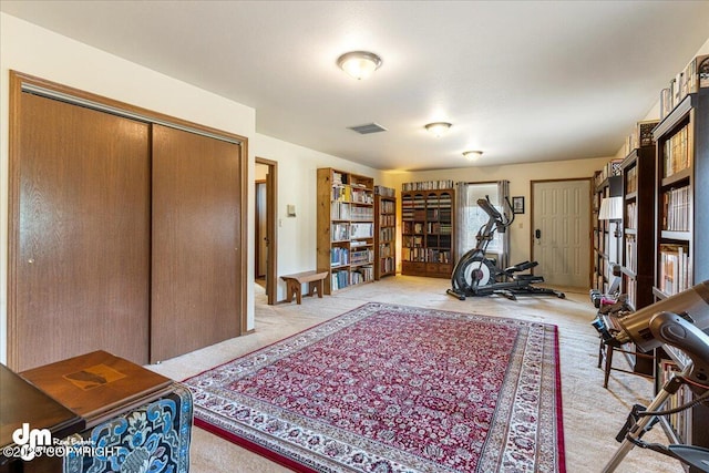 interior space featuring visible vents and light carpet