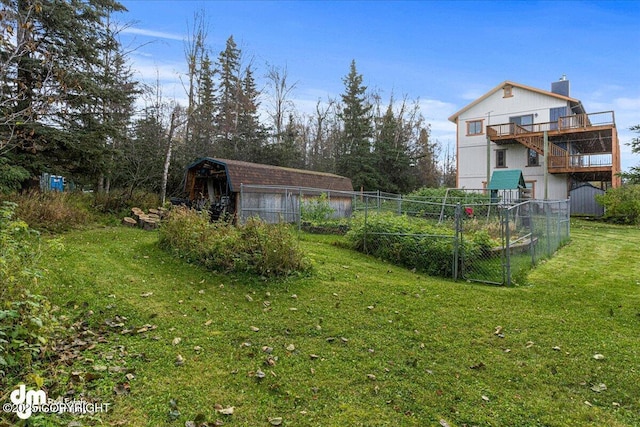 view of yard with an outdoor structure and fence