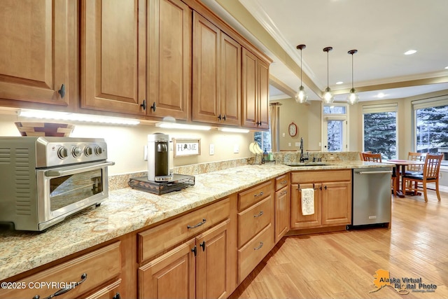 kitchen featuring a toaster, ornamental molding, a sink, light wood-style floors, and stainless steel dishwasher