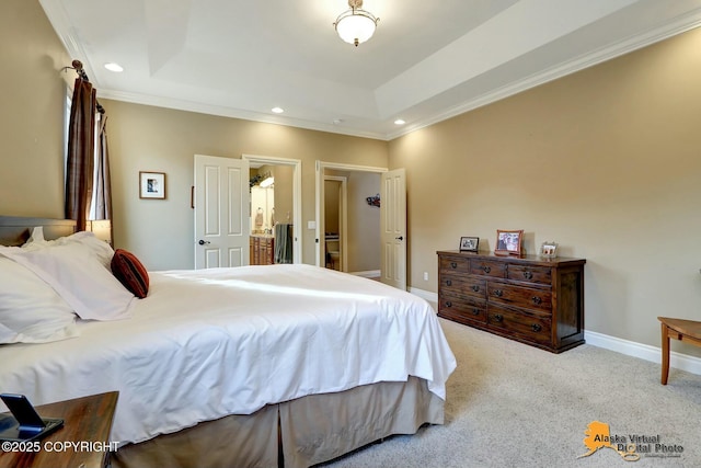 bedroom with baseboards, crown molding, a tray ceiling, and carpet floors