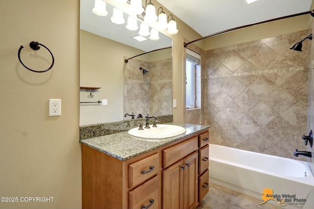 bathroom with vanity and washtub / shower combination