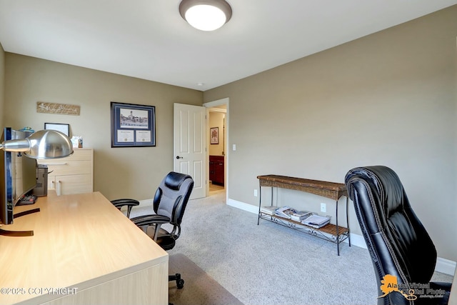 carpeted office featuring baseboards