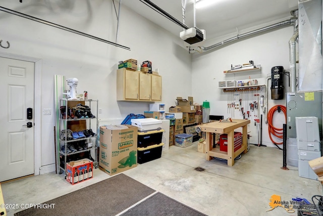 garage with a workshop area and a garage door opener