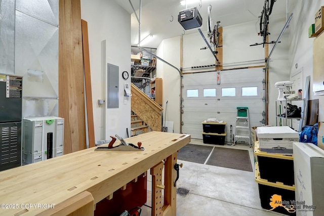 garage featuring electric panel and a garage door opener