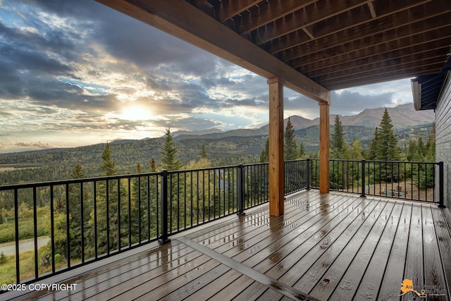 wooden deck with a mountain view