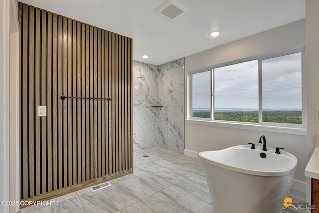 full bath featuring a marble finish shower, visible vents, recessed lighting, and a soaking tub