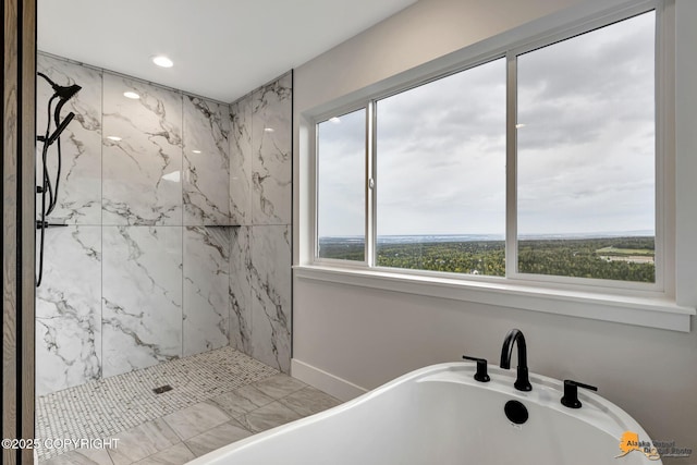 full bath with a marble finish shower, recessed lighting, and a freestanding tub