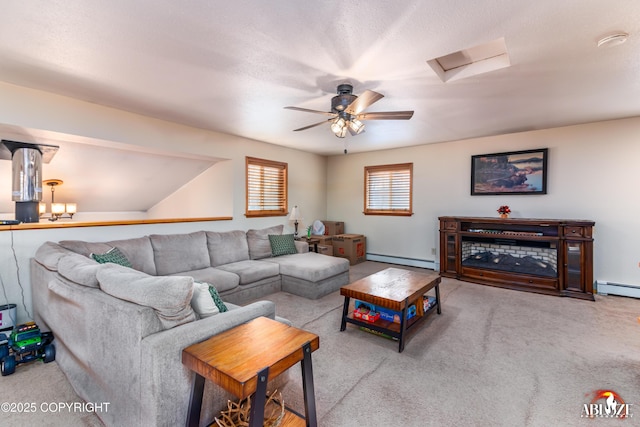 carpeted living room featuring a baseboard radiator, attic access, and a baseboard heating unit