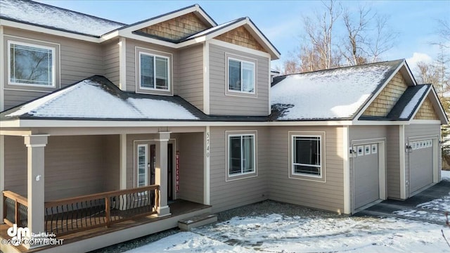 view of front of home with a porch and a garage