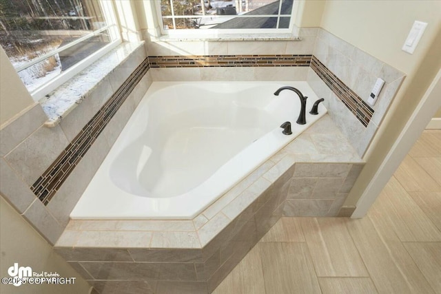 full bathroom with a garden tub