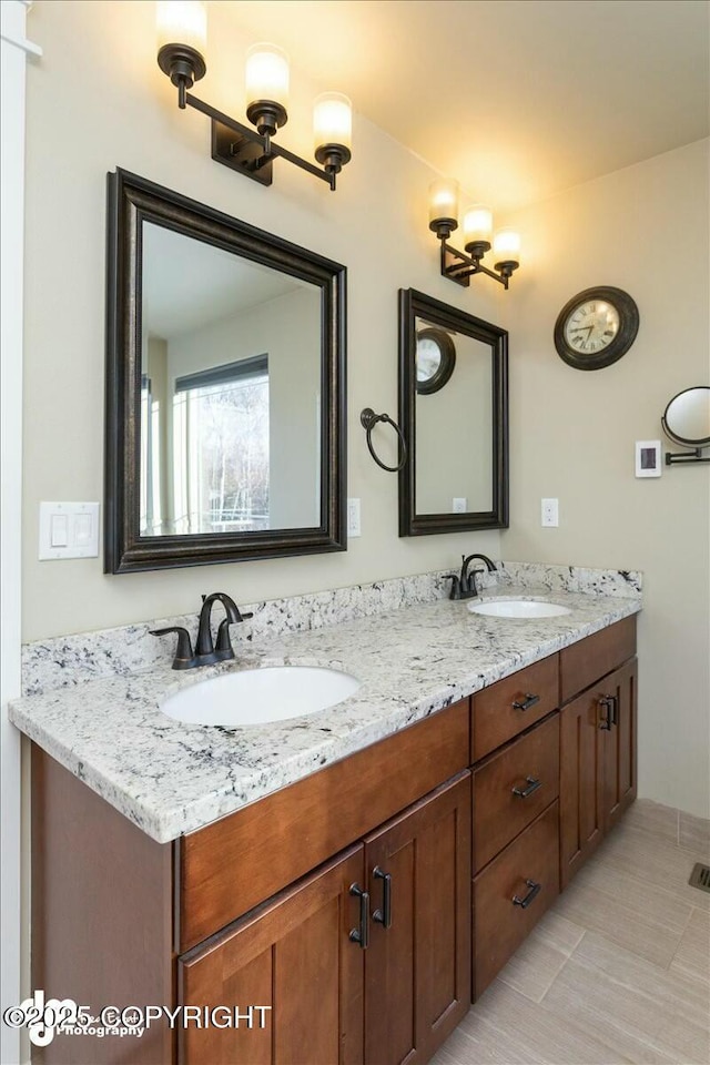 bathroom with double vanity and a sink