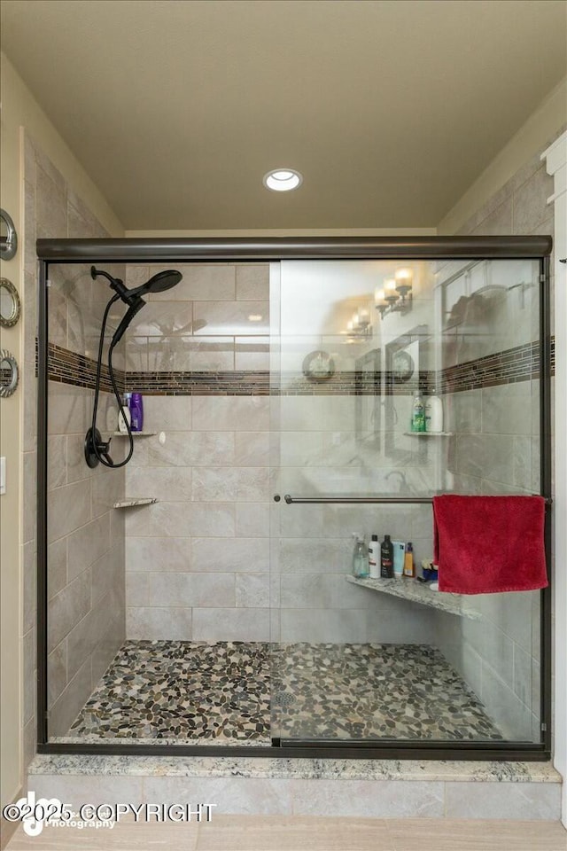 full bathroom featuring a shower stall