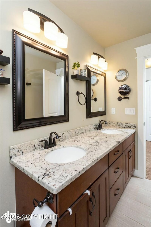 full bath with double vanity and a sink