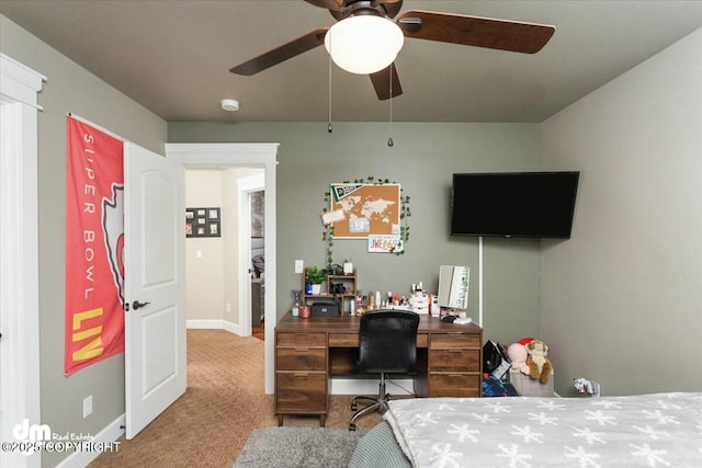 bedroom with ceiling fan, baseboards, and carpet floors